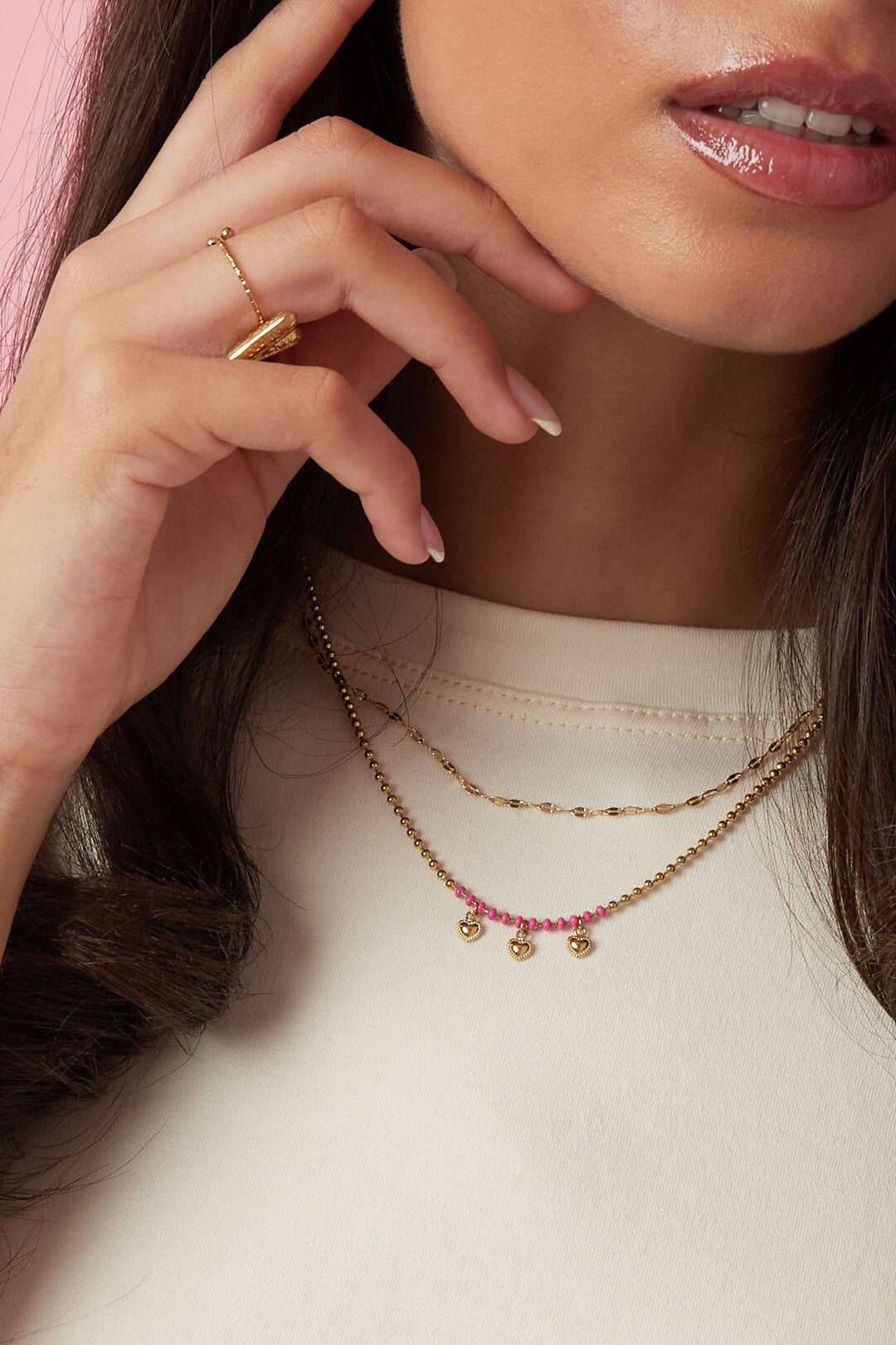 Layered necklaces with beads and hearts