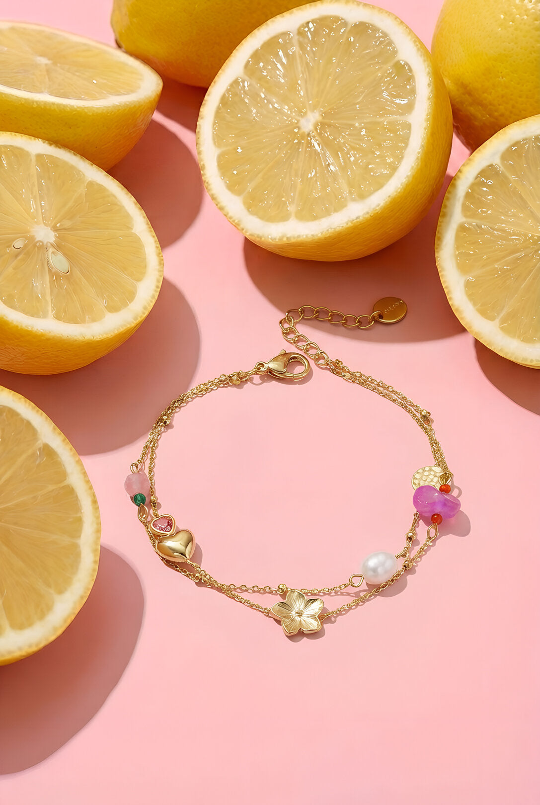 Charm bracelet with heart, flower, pearl and beads